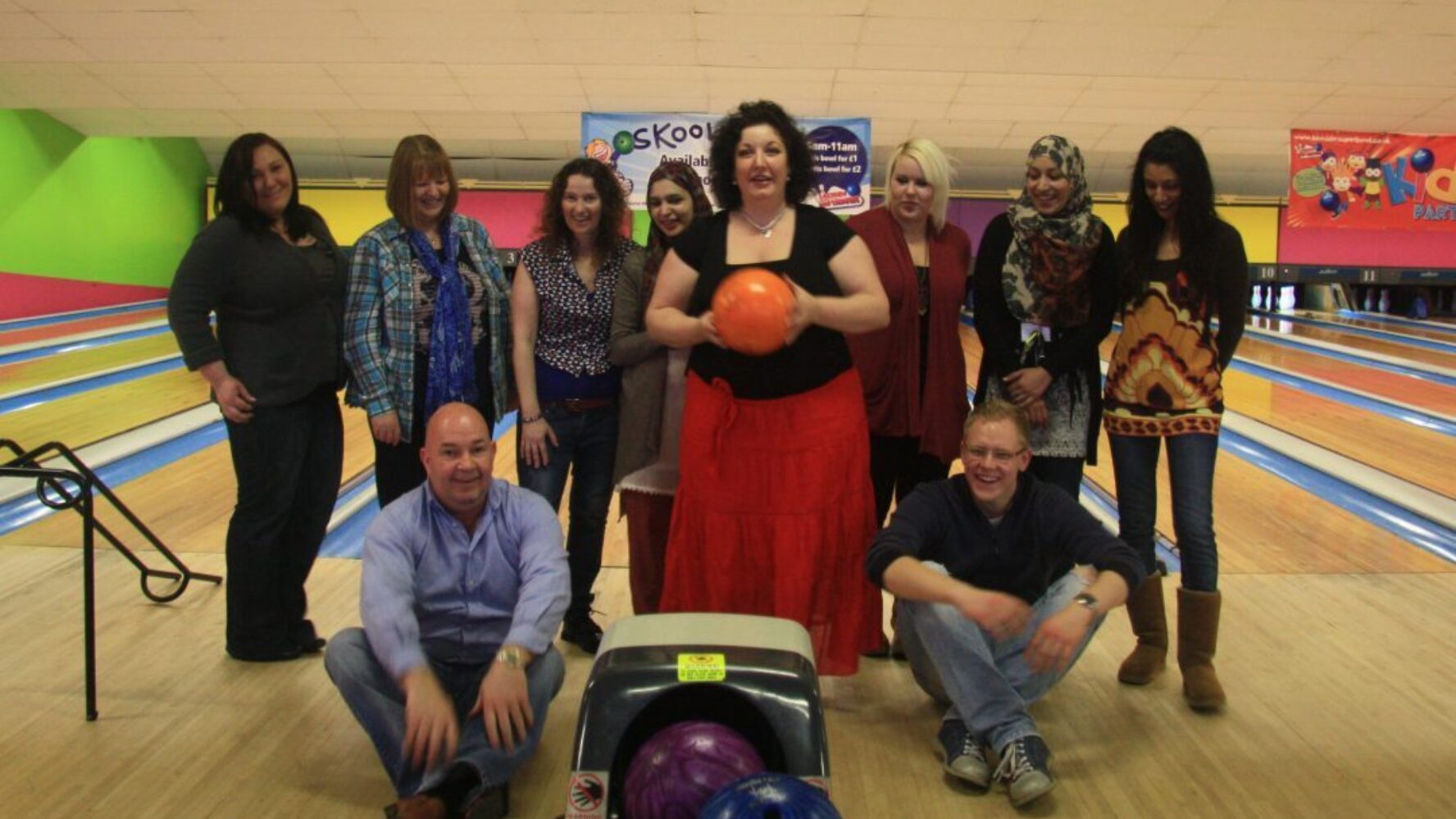 A group of people at a bowling alley