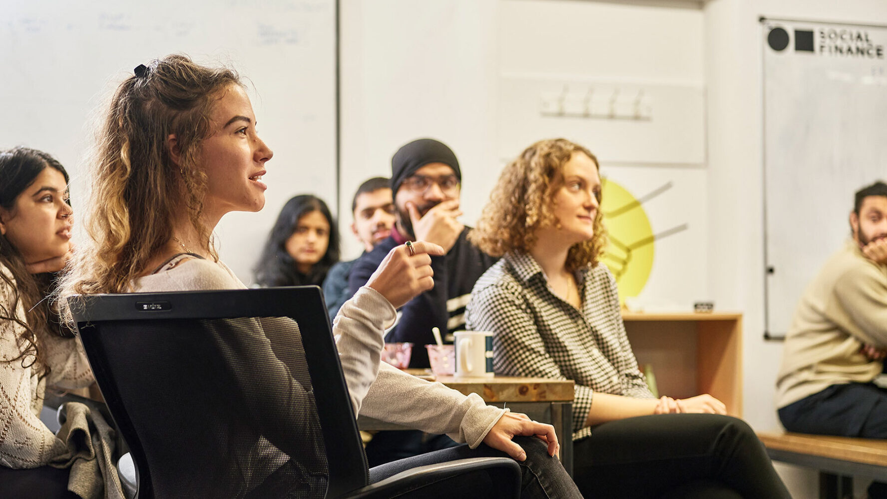 A group of people taking part in a meeting